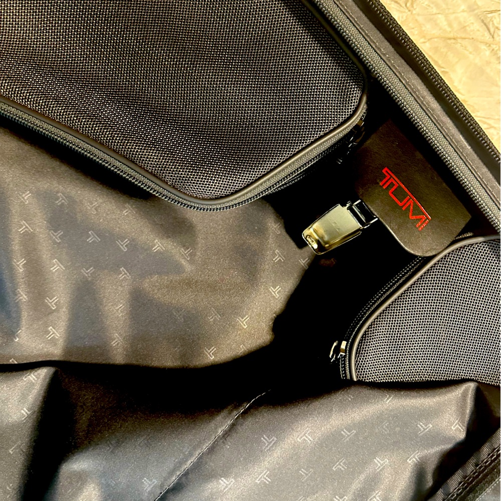 Black TUMI Alpha Garment 4-Wheeled Carry-On.  Dimensions
14.5" X 22.0" X 9.0"